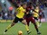 Troy Deeney of Watford holds off the challenge of Alex Tettey of Norwich during the Sky Bet Championship match between Watford and Norwich City at Vicarage Road on February 21, 2015