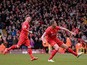 Liverpool's English midfielder Jordan Henderson celebrates after scoring the opening goal of during the English Premier League football match between Liverpool and Manchester City at the Anfield stadium in Liverpool, north west England, on March 1, 2015