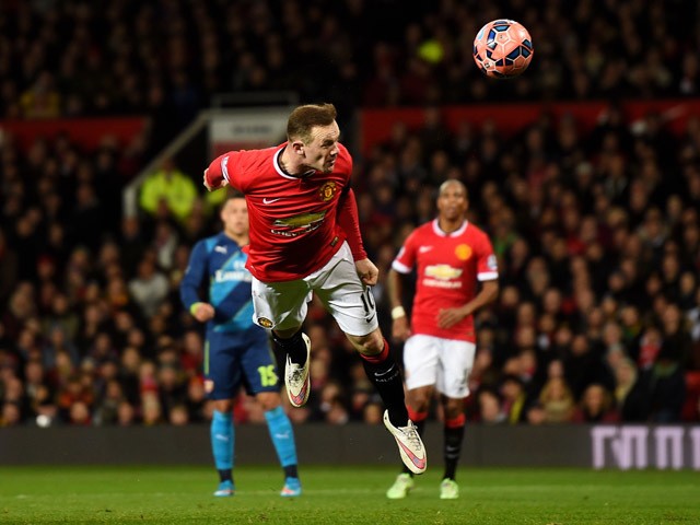 Wayne Rooney of Manchester United scores a goal to level the scores at 1-1 during the FA Cup Quarter Final match between Manchester United and Arsenal at Old Trafford on March 9, 2015