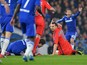 Paris Saint-Germain's Swedish forward Zlatan Ibrahimovic gestures to the referee after a clash with Chelsea's Brazilian midfielder Oscar which resulted in a red card for Ibrahimovic during the UEFA Champions League round of 16 second leg football match be