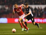 Dexter Blackstock of Nottingham Forest is chased by Lee Frecklington of Rotherham United during the Sky Bet Championship match on March 18, 2015