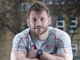 Mark Cueto leans on a rugby ball