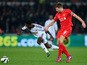 Liverpool player Steven Gerrard challenges Nathan Dyer of Swansea during the Barclays Premiership match between Swansea City and Liverpool at Liberty Stadium on March 16, 2015