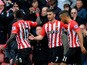 Shane Long of Southampton celebrates with team-mates after scoring the opening goal during the Barclays Premier League match between Southampton and Burnley at St Mary's Stadium on March 21, 2015