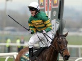 Jockey A P McCoy celebrates after winning on Don't Push It following The Grand National steeplechase at Aintree Racecourse in Liverpool, north-west England on April 10, 2010
