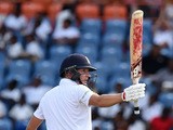 England's batsman Gary Ballance reacts after scoring his half-century (50 runs) during day three of the second Test cricket match between the West Indies and England at the Grenada National Stadium in Saint George's on April 23, 2015