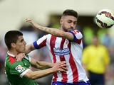 Atletico Madrid's Brazilian defender Guilherme Siqueira vies with Athletic Bilbao's defender Unai Bustinza during the Spanish league football match Club Atletico de Madrid vs Athletic Club Bilbao at the Vicente Calderon stadium in Madrid on May 2, 2015