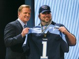 NFL Commissioner Roger Goodell holds up a jersey after the Tennessee Titans chose Marcus Mariota of the Oregon Ducks #2 overall during the first round of the 2015 NFL Draft at the Auditorium Theatre of Roosevelt University on April 30, 2015