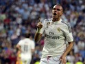 Real Madrid's Portuguese defender Pepe celebrates after scoring during the Spanish league football match Real Madrid CF vs Valencia CF at the Santiago Bernabeu stadium in Madrid on May 9, 2015
