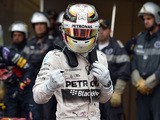 Mercedes AMG Petronas F1 Team's British driver Lewis Hamilton reacts as he celebrates taking the pole position in the parc fermee after the qualifying session at the Monaco street circuit in Monte-Carlo on May 23, 2015
