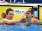 Team GB swimmers Cameron Kurle and Duncan Scott celebrate winning silver and gold respectively in the men's 200m freestyle at the European Games on June 27, 2015