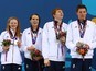 Team GB's mixed relay team Georgia Coates, Darcy Deakin, Martyn Walton and Duncan Scott collect their silver medals at the European Games on June 24, 2015