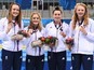 Team GB's women's 4x100m medley relay team - Rebecca Sherwin, Amelia Clynes, Layla Black and Georgia Coates - pose with their bronze medals at the European Games on June 25, 2015