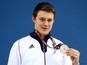 Team GB swimmer Luke Davies holds his bronze medal earned during the 200m breaststroke final at the European Games on June 24, 2015