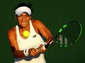 Heather Watson of Great Britain in action in her Ladies Singles first round match against Caroline Garcia of France during day one of the Wimbledon Lawn Tennis Championships at the All England Lawn Tennis and Croquet Club on June 29, 2015