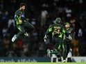 Pakistan cricketer Imad Wasim (L) and teammates celebrate after dismissing Sri Lankan cricketer Dinesh Chandimal during the third one day international (ODI) cricket match between Sri Lanka and Pakistan at the R. Premadasa International Cricket Stadium in