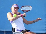 Jordanne Whiley of Great Britain in action in their match with Yui Kamiji of Japan against Sharon Walraven of the Netherlands and Katharina Kruger of Germany during the Australian Open 2015 Wheelchair Championships at Melbourne Park on January 29, 2015
