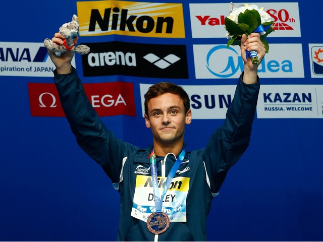 Bronze medalist Tom Daley of Great Britain poses with the medal won in the Men's 10m Platform final on day nine of the 16th FINA World Championships at the Aquatics Palace on August 2, 2015