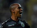 Sporting's forward Joao Mario celebrates after scoring the opening goal during the Portuguese Liga football match CD Tondela vs SC Sporting at the Aveiro City stadium in Aveiro on August 14, 2015