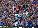 West Ham United's Senegalese midfielder Cheikhou Kouyate celebrates in front of supporters after scoring their second goal during the English Premier League football match between West Ham United and Bournemouth at The Boleyn Ground in Upton Park, East Lo
