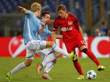 Stefan Kiessling (R) of Bayer Leverkusen competes for the ball with Miroslav Klose (C) and Dusan Basta of SS Lazio during the UEFA Champions League qualifying round play off first leg match between SS Lazio and Bayer Leverkusen at Olimpico Stadium on Augu