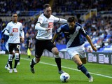 Jon Toral of Birmingham is challenged by Richard Keogh of Derby during the Sky Bet Championship match between Birmingham City and Derby County at St Andrews (stadium) on August 21, 2015