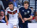 Jonas Hector of Germany is closed down by James Forrest of Scotland during the UEFA EURO 2016 Qualifier Group D match between Scotland and Germany at Hampden Park on September 7, 2015 in Glasgow, Scotland.