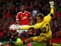 Anthony Martial sends the ball past Liverpool keeper Simon Mignolet for his first Man Utd goal on September 12, 2015