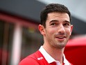 Alexander Rossi of the United States and Manor Marussia walks in the paddock during previews to the Formula One Grand Prix of Singapore at Marina Bay Street Circuit on September 17, 2015