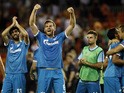 Zenit's Belgian defender Nicolas Lombaerts (2nd L) and teammate Zenit's Portuguese defender Luis Neto (L) celebrate their victoy after the UEFA Champions League group H football match Valencia CF vs FC Zenit at the Mestalla stadium in Valencia on Septembe