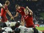 England's lock Joe Launchbury (R) reacts as England's back row Billy Vunipola scores a try during a Pool A match of the 2015 Rugby World Cup between England and Fiji at Twickenham stadium in south west London on September 18, 2015
