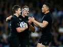 Beauden Barrett (L) of the New Zealand All Blacks celebrates with Sam Cane and Sonny Bill Williams after scoring his teams fourth try during the 2015 Rugby World Cup Pool C match between New Zealand and Namibia at the Olympic Stadium on September 24, 2015