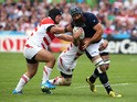 Josh Strauss of Scotland is tackled during the 2015 Rugby World Cup Pool B match between Scotland and Japan at Kingsholm Stadium on September 23, 2015