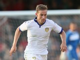 Charlie Taylor of Leeds United runs with the ball during the pre season friendly match between York City and Leeds United at Bootham Crescent on July 15, 2015 in York, England.