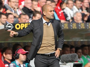 Bayern Munich's Spanish head coach Pep Guardiola reacts during the German first division Bundesliga football match 1 FSV Mainz 05 vs FC Bayern Muenchen in Mainz, southern Germany, on September 26, 2015