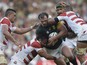 South Africa's hooker Bismarck du Plessis (C) is takcled during a Pool B match of the 2015 Rugby World Cup between South Africa and Japan at the Brighton community stadium in Brighton, south east England on September 19, 2015.