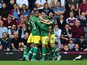 Robbie Brady (C) of Norwich City celebrates scoring his team's first goal with his team mates during the Barclays Premier League match between West Ham United and Norwich City at the Boleyn Ground on September 26, 2015