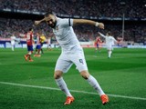 Karim Benzema of Real Madrid celebrates after scoring Real's opening goal during the La Liga match between Club Atletico de Madrid and Real Madrid at Vicente Calderon Stadium on October 4, 2015