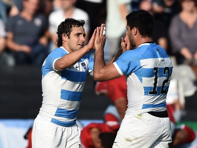 Argentina's fly half Nicolas Sanchez (L) celebrates with Argentina's centre Jeronimo de la Fuente after a Pool C match of the 2015 Rugby World Cup between Argentina and Tonga at Leicester City Stadium in Leicester, central England, on October 4, 2015
