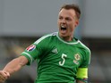 Jonny Evans of Northern Ireland celebrates after the EURO 2016 Group F qualifier at Windsor Park on March 29, 2015 in Belfast, Northern Ireland.