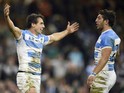 Argentina's wing Juan Imhoff (L) celebrates after scoring his team's fourth try during a quarter final match of the 2015 Rugby World Cup between Ireland and Argentina at the Millennium Stadium in Cardiff, south Wales, on October 18, 2015.