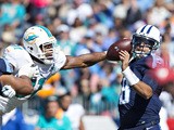 Marcus Mariota #8 of the Tennessee Titans has the ball knocked loose by Cameron Wake #91 of the Miami Dolphins at LP Field on October 18, 2015