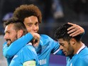 Zenit's Portuguese midfielder Miguel Danny, Zenit's Belgian midfielder Axel Witsel and Zenit's Brazilian forward Hulk celebrate a goal during the UEFA Champions League group H football match between FC Zenit and Olympique Lyonnais at the Petrovsky stadium
