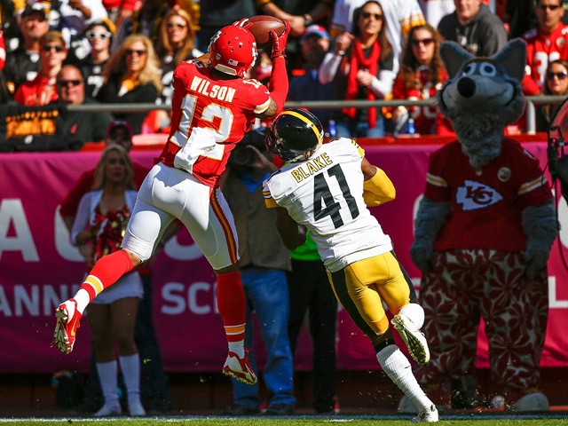 Albert Wilson #12 of the Kansas City Chiefs makes a catch over Antwon Blake #41 of the Pittsburgh Steelers at Arrowhead Stadium during the game on October 25, 2015
