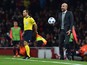 Bayern Munich's Spanish head coach Pep Guardiola reacts as he holds a ball that went out of play during the UEFA Champions League football match between Arsenal and Bayern Munich at the Emirates Stadium in London, on October 20, 2015. 