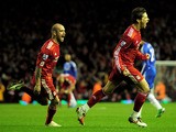 Fernando Torres (R) of Liverpool celebrates scoring his team's second goal with team mate Raul Meireles during the Barclays Premier League match between Liverpool and Chelsea at Anfield on November 7, 2010 