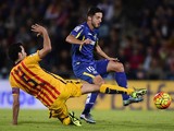 Barcelona's midfielder Sergio Busquets (L) vies with Getafe's midfielder Pablo Sarabia during the Spanish league football match Getafe CF vs FC Barcelona at the Coliseum Alfonso Perez stadium in Getafe on October 31, 2015. 