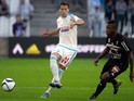 Nice's Ivorian midfielder Jean Michel Seri (R) vies with Marseille's Spanish defender Javier Manquillo during the French L1 football match between Olympique de Marseille vs Nice on November 8, 2015 at the Velodrome stadium in Marseille, southern France.