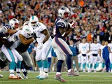 Dion Lewis #33 of the New England Patriots scores a touchdown during the second quarter against the Miami Dolphins at Gillette Stadium on October 29, 2015