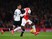Joel Campbell of Arsenal (r) holds off Dele Alli of Spurs during the Barclays Premier League match between Arsenal and Tottenham Hotspur at the Emirates Stadium on November 8, 2015 in London, England.